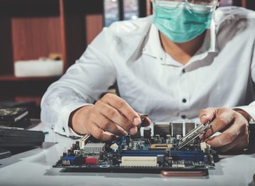 The technician repairing the computer,computer hardware, repairing, upgrade and technology